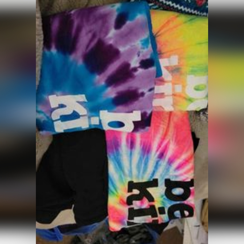 3 long sleeve Sunshine Sisters baseball t-shirts and a pair on black shorts
